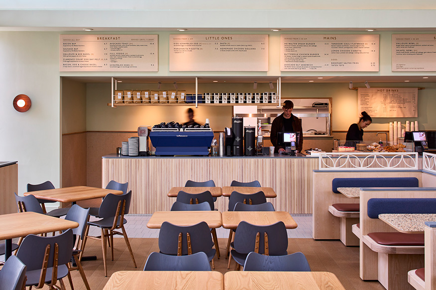 Butterfly chairs upholstered in Warm Grey and the frame finished in Original (OG) in the Collicci Café
